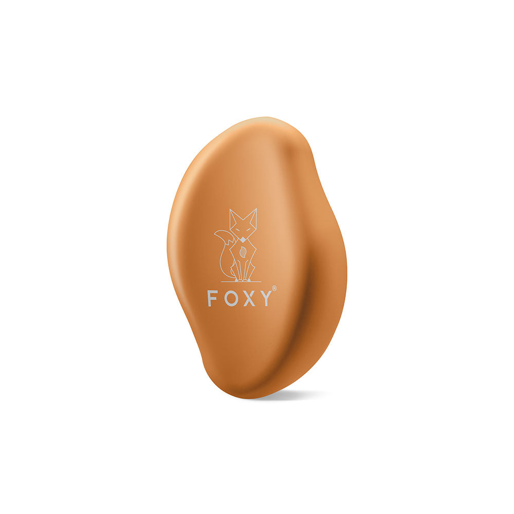 Gold, Matte, Oval-shaped hair removal tool with a stylized fox logo and the word FOXY printed on it.